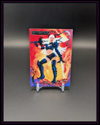 Trading Card "Magik" Matriarchs mit Superheldin vor feurigem Hintergrund, auf Kartenständer
