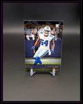 NFL Trading Card eines Football-Spielers im Dallas-Cowboys-Trikot auf Ständer