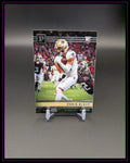 Football Trading Card mit Chris Olave im New Orleans Saints Trikot auf Rasen