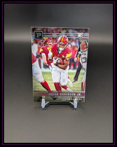 Panini Football Rookie Card mit Spieler in roter Uniform und silbernem Schriftzug, Sammelkarte